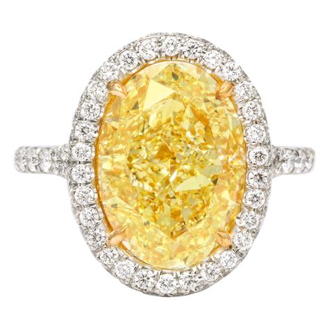 GIA Certified 5.04 Carat Fancy Yellow Oval Diamond Ring with